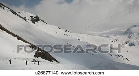 Stock Image - Skiers in action, Zermatt, Valais Canton, Switzerland. Fotosearch