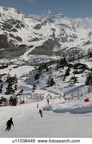 Stock Photo - Skiers in action, Zermatt, Valais Canton, Switzerland. Fotosearch