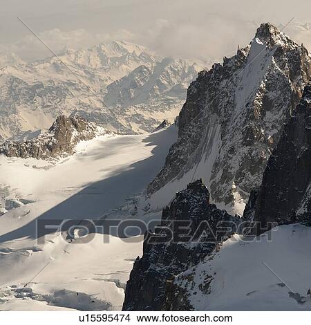 Picture - Snow covered mountains in winter, Aiguille Du Midi, Mont Blanc, Chamonix, Rhone-Alpes, France. Fotosearch