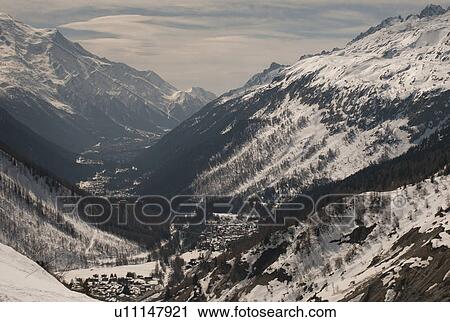 Stock Image - Snow covered mountains in winter, Domaine De Balme, Vallorcine, Mont Blanc, Chamonix, Rhone-Alpes, France. Fotosearch