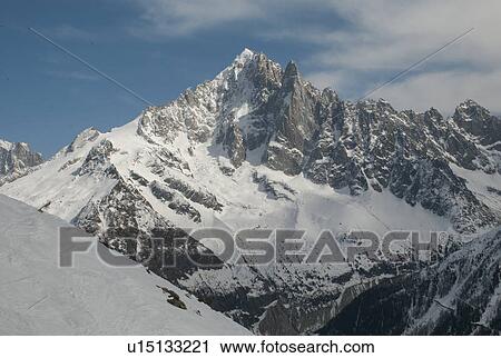 Stock Image - Snow covered mountains in winter, Brevent, Flegere, Mont Blanc, Chamonix, Rhone-Alpes, France. Fotosearch