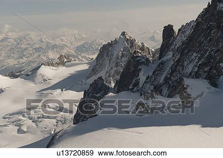 Snow covered mountains in winter, Aiguille Du Midi, Mont Blanc, Chamonix, Rhone-Alpes, France View Large Photo Image Stock Photo - Snow covered mountains in winter, Aiguille Du Midi, Mont Blanc, Chamonix, Rhone-Alpes, France. Fotosearch