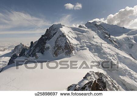 Snow covered mountains in winter, Aiguille Du Midi, Mont Blanc, Chamonix, Rhone-Alpes, France View Large Photo Image Stock Photo - Snow covered mountains in winter, Aiguille Du Midi, Mont Blanc, Chamonix, Rhone-Alpes, France. Fotosearch