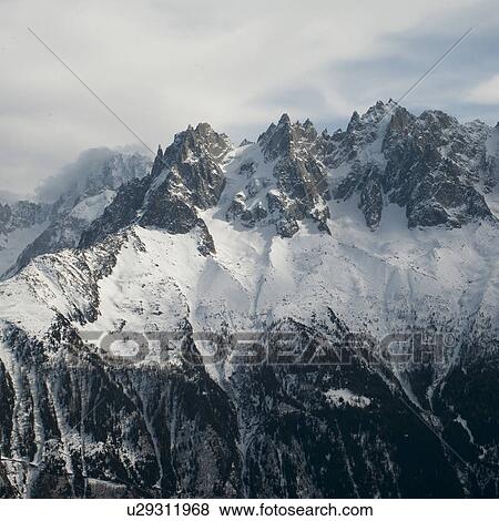 Snow covered mountains in winter, Brevent, Flegere, Mont Blanc, Chamonix, Rhone-Alpes, France View Large Photo Image Stock Photo - Snow covered mountains in winter, Brevent, Flegere, Mont Blanc, Chamonix, Rhone-Alpes, France. Fotosearch
