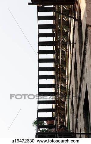 Stock Image - Stairs of a fire escape on the exterior of a building, Ville-Marie, Montreal, Quebec, Canada. Fotosearch