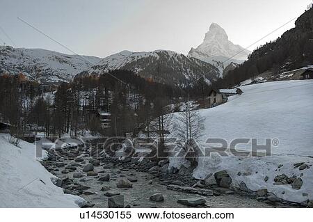 Stock Photography - Stream flowing through mountains in winter, Mt Matterhorn, Zermatt, Valais Canton, Switzerland. Fotosearch