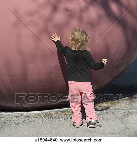 Toddler touching a boulder, Enge, Zurich, Switzerland View Large Photo Image Stock Image - Toddler touching a boulder, Enge, Zurich, Switzerland. Fotosearch