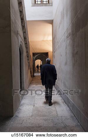 Picture - Tourist walking through a corridor of a harem at Topkapi Palace, Istanbul, Turkey. Fotosearch