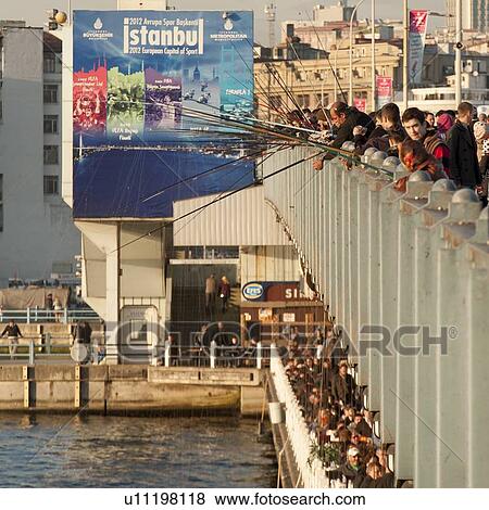 Stock Photo - Tourists fishing in the Bosphorus River, Istanbul, Turkey. Fotosearch