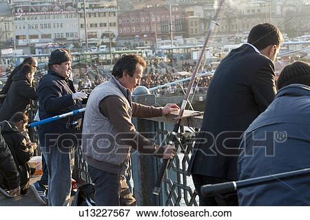 Tourists on Galata Bridge and fishing in Bosphorus river, Istanbul, Turkey View Large Photo Image Stock Photo - Tourists on Galata Bridge and fishing in Bosphorus river, Istanbul, Turkey. Fotosearch
