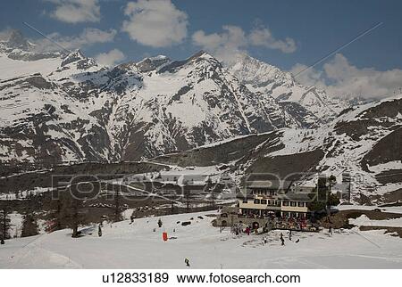 Stock Photo - Tourists skiing, Zermatt, Valais Canton, Switzerland. Fotosearch