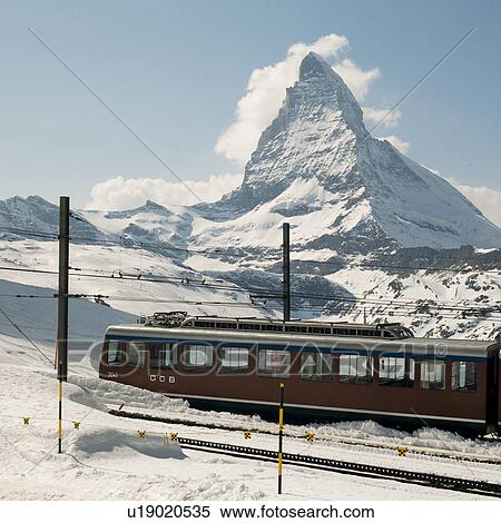 Stock Photography - Train on snow covered tracks in front of the Mt Matterhorn, Zermatt, Valais Canton, Switzerland. Fotosearch