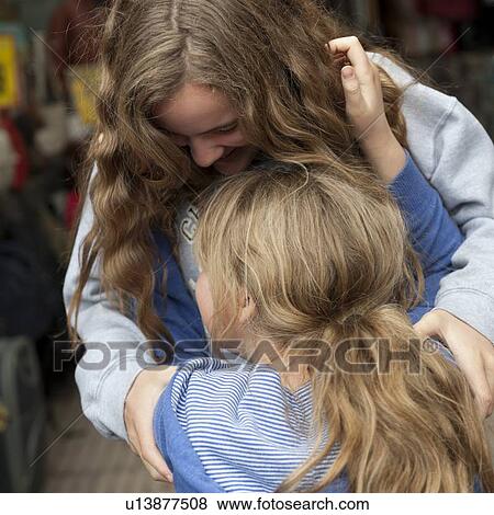 Two girls hugging each other, Istanbul, Turkey View Large Photo Image Stock Photo - Two girls hugging each other, Istanbul, Turkey. Fotosearch