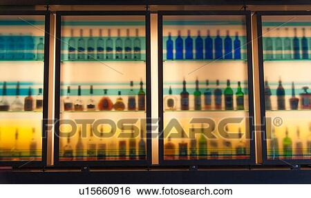 Stock Photograph - Wine bottles arranged in shelves in a liquor shop, Montreal, Quebec, Canada. Fotosearch