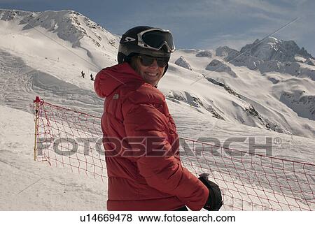 Woman in ski-wear at ski resort, Domaine De Balme, Vallorcine, Mont Blanc, Chamonix, Rhone-Alpes, France View Large Photo Image Stock Photo - Woman in ski-wear at ski resort, Domaine De Balme, Vallorcine, Mont Blanc, Chamonix, Rhone-Alpes, France. Fotosearch