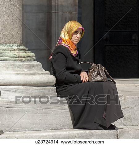 Woman sitting near a column, Blue Mosque, Istanbul, Turkey View Large Photo Image Picture - Woman sitting near a column, Blue Mosque, Istanbul, Turkey. Fotosearch
