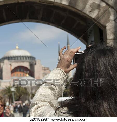 Stock Photo - Woman taking picture of Aya Sofya museum, Istanbul, Turkey. Fotosearch