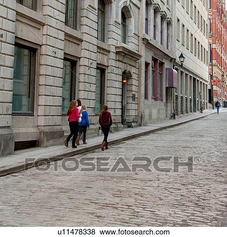 Stock Photo - Women walking in a street, Ville-Marie, Montreal, Quebec, Canada. Fotosearch