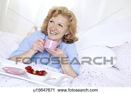 Breakfast in bed View Large Photo Image Stock Image - Breakfast in bed. Fotosearch