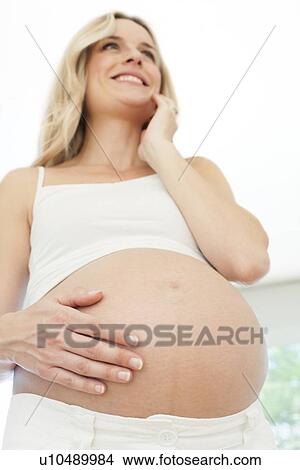 Happy pregnant woman View Large Photo Image Picture - Happy pregnant woman. Fotosearch