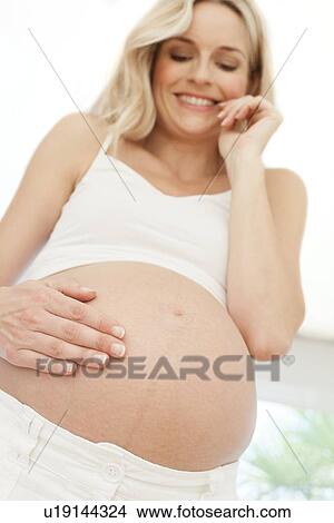 Happy pregnant woman View Large Photo Image Picture - Happy pregnant woman. Fotosearch