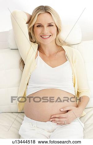 Happy pregnant woman View Large Photo Image Stock Photo - Happy pregnant woman. Fotosearch