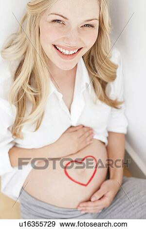 Stock Photo - Happy pregnant woman. Fotosearch