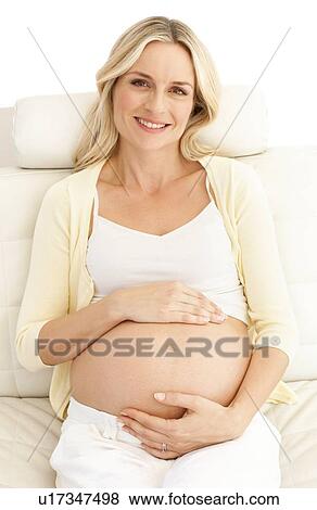 Stock Photo - Happy pregnant woman. Fotosearch