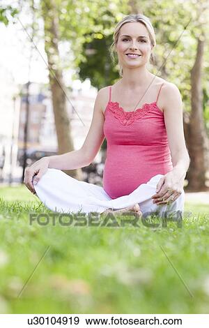 Stock Photo - Happy pregnant woman. Fotosearch