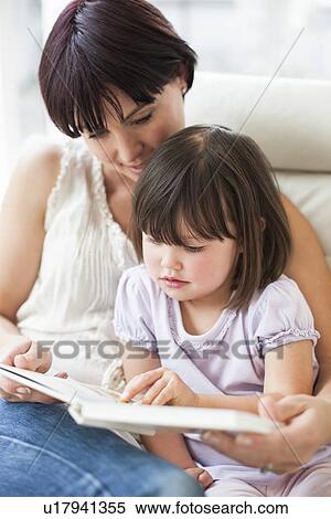 Mother and daughter reading View Large Photo Image Stock Photography - Mother and daughter reading. Fotosearch