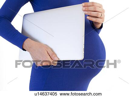 Pregnant woman with a laptop View Large Photo Image Stock Photography - Pregnant woman with a laptop. Fotosearch