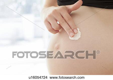 Pregnant woman's abdomen View Large Photo Image Picture - Pregnant woman's abdomen. Fotosearch