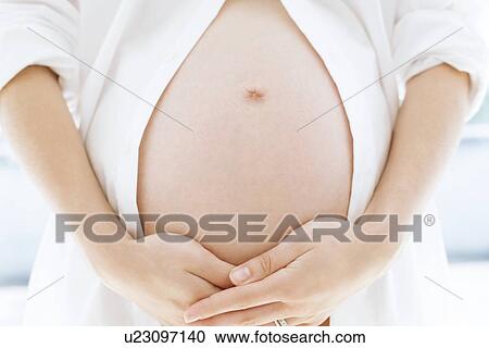 Pregnant woman's abdomen View Large Photo Image Stock Image - Pregnant woman's abdomen. Fotosearch