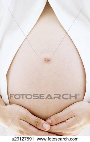 Pregnant woman's abdomen View Large Photo Image Stock Image - Pregnant woman's abdomen. Fotosearch