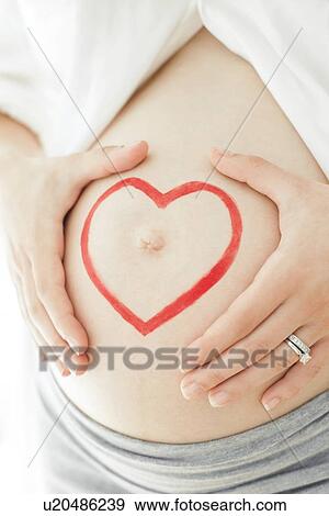 Stock Photo - Pregnant woman's abdomen. Fotosearch