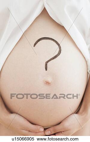 Stock Photography - Pregnant woman's abdomen. Fotosearch