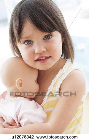 Toddler and doll View Large Photo Image Stock Image - Toddler and doll. Fotosearch