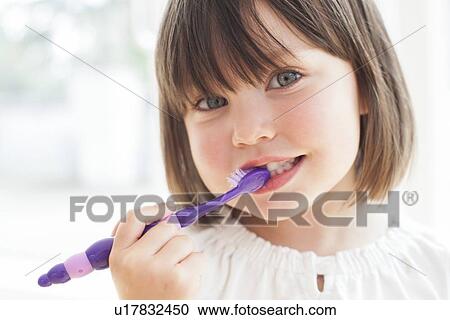 Toddler brushing her teeth View Large Photo Image Stock Image - Toddler brushing her teeth. Fotosearch