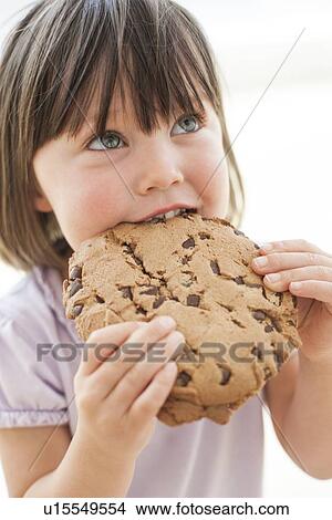 Picture - Toddler eating a cookie. Fotosearch