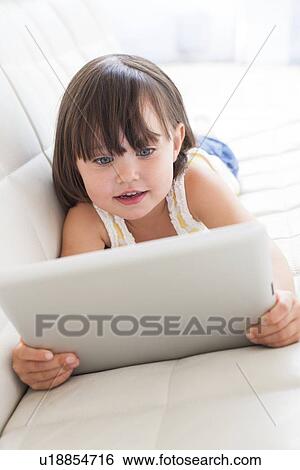 Stock Photograph - Toddler using a tablet computer. Fotosearch