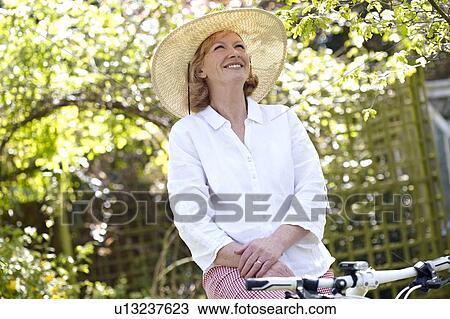 Stock Image - Woman cycling. Fotosearch