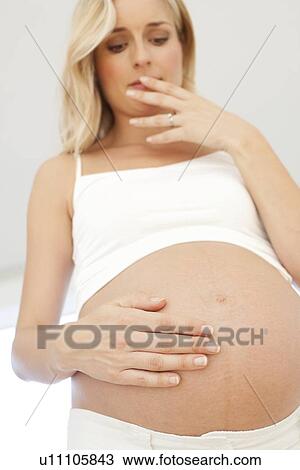 Worried pregnant woman View Large Photo Image Stock Image - Worried pregnant woman. Fotosearch