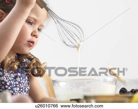 Young girl baking View Large Photo Image Stock Photograph - Young girl baking. Fotosearch