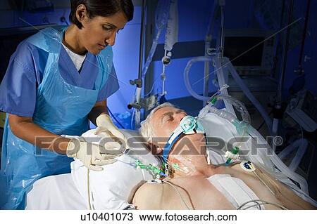 Stock Image - Administering drugs. Fotosearch