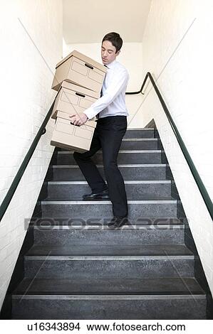 Picture - Carrying boxes. Fotosearch