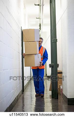 Stock Image - Carrying boxes. Fotosearch