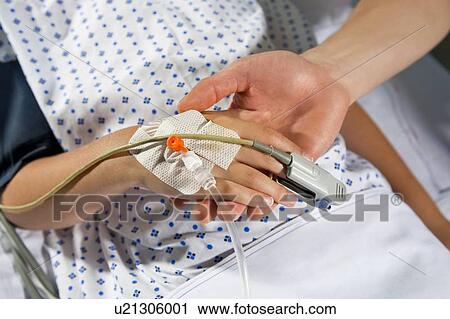 Stock Image - Intensive care patient's hand. Fotosearch