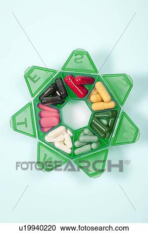 Stock Image - Pills in a pill box. Fotosearch