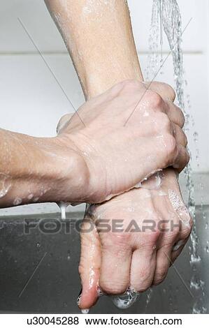 Stock Photo - Scrubbing up before surgery. Fotosearch