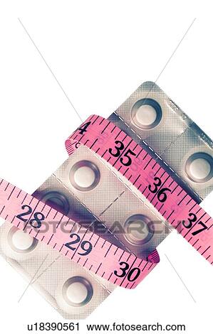 Stock Image - Slimming pills, conceptual image. Fotosearch